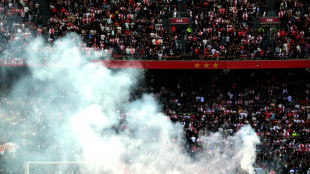 Ajax-Feyenoord scrapped after flares thrown on pitch, violence erupts
