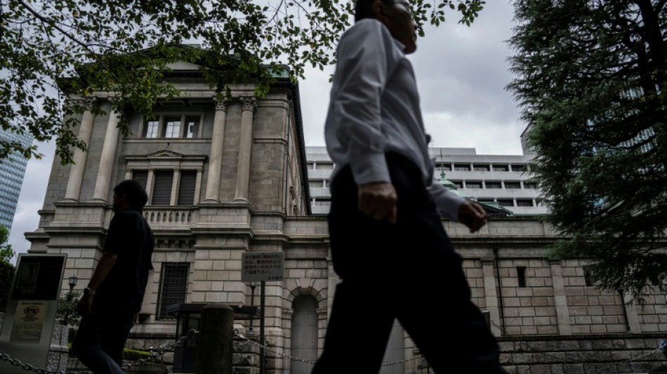 Global stocks mixed as yen falls despite Bank of Japan rate hike