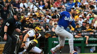 Ohtani held out of Dodgers lineup with sore knee