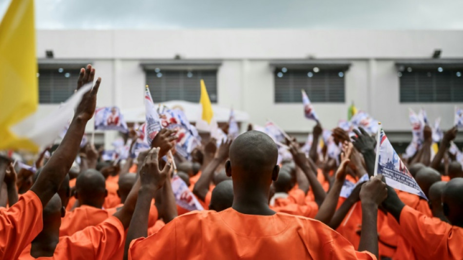 Fresh paint, careful choreography as pope visits African prison