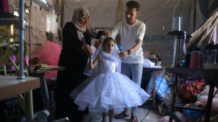 Gaza tailor turns waste fabrics into dresses for girls