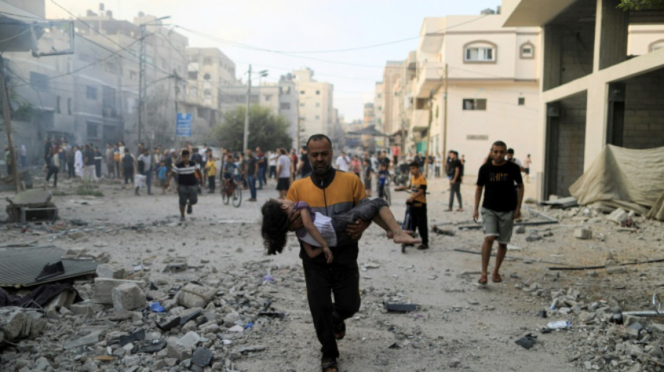 One week into war, thousands on the run in Gaza fearing Israel ground offensive