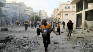 One week into war, thousands on the run in Gaza fearing Israel ground offensive
